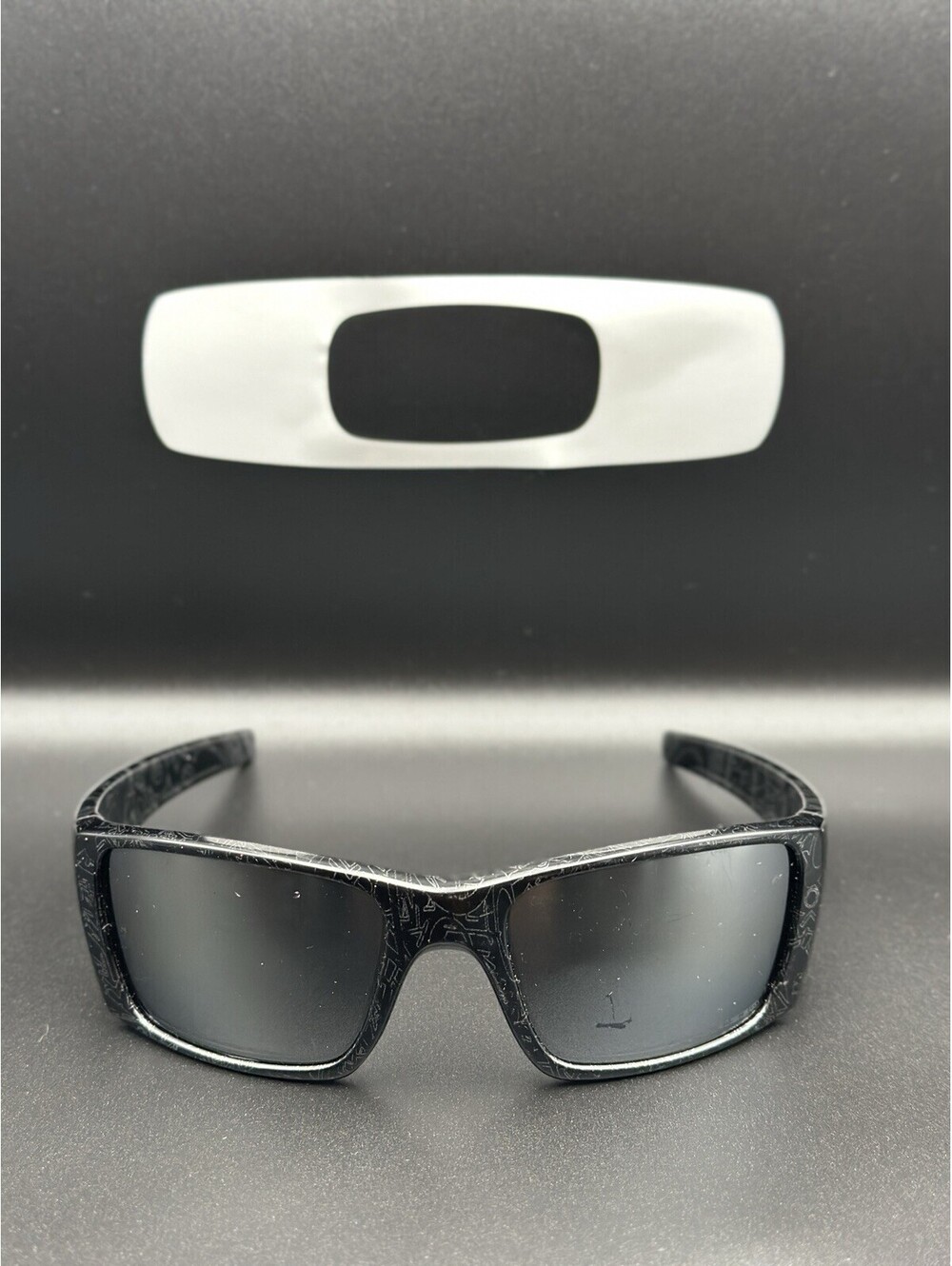 Oakley Fuel Cell Polished Black Ghost Text w/ Black Iridium Polarized Lenses